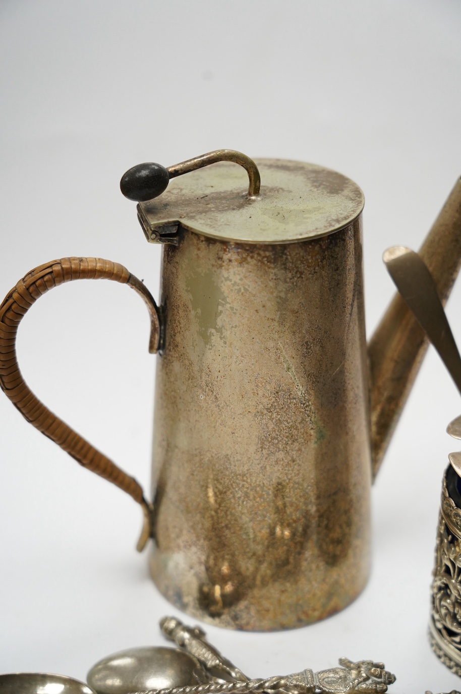 Small silver including a late Victorian pierced silver mustard pot, a small cream jug and oval trinket box, together with five metal spoons and a plated hot water jug. Condition - poor to fair